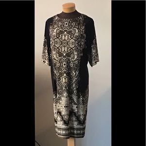 Dress with Placement print on black background.